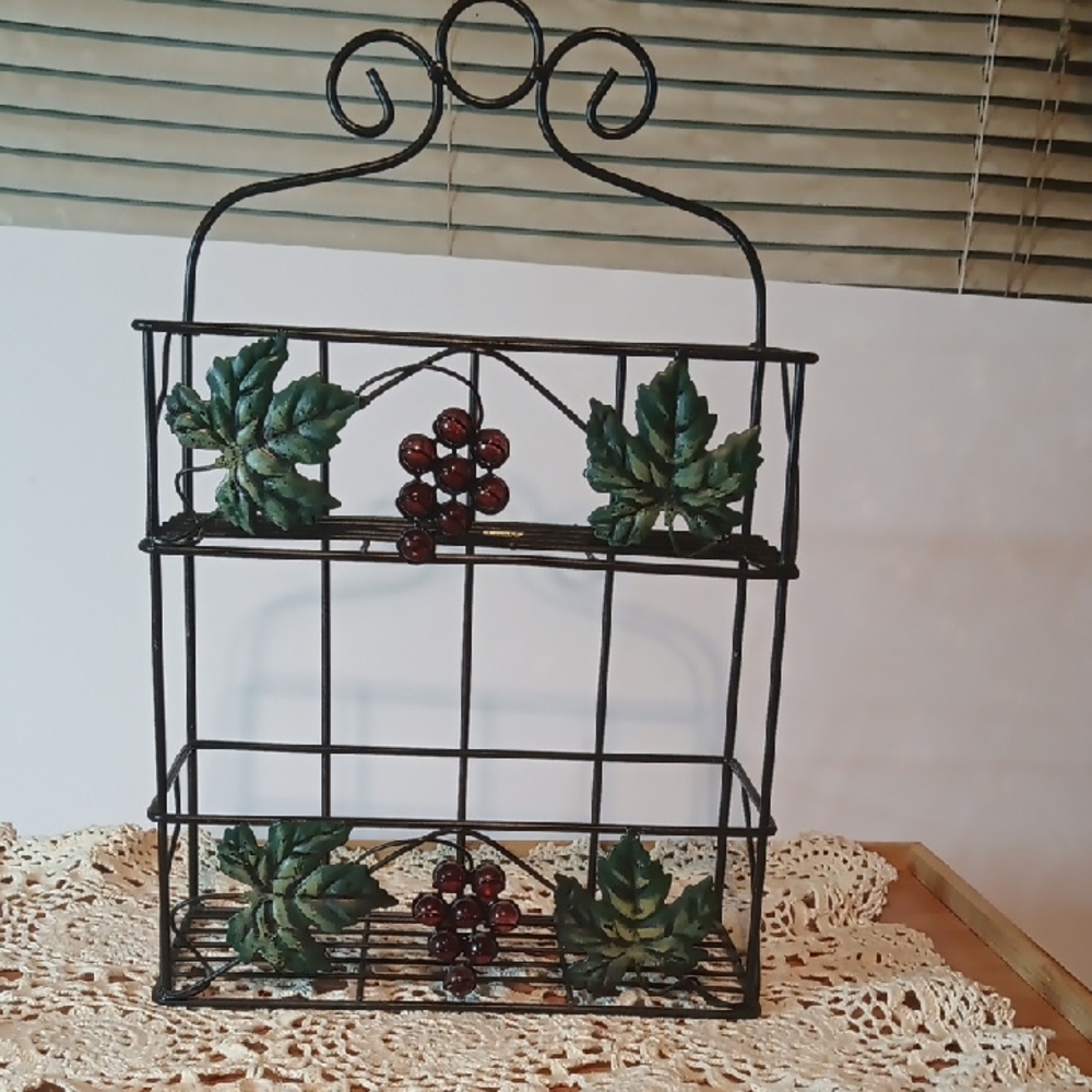 Source Unknown Black and Green Display Shelves with Nature-Inspired Design